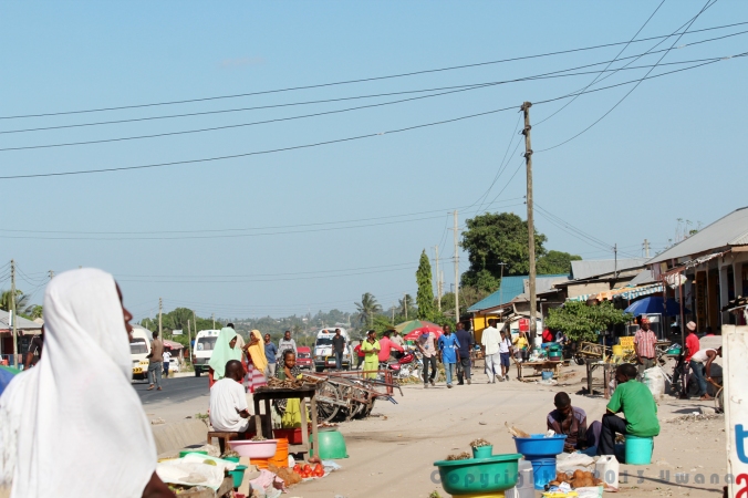 Busy, colorful street market on a hot, hot day in Dar-es-Salaam, Tanzania