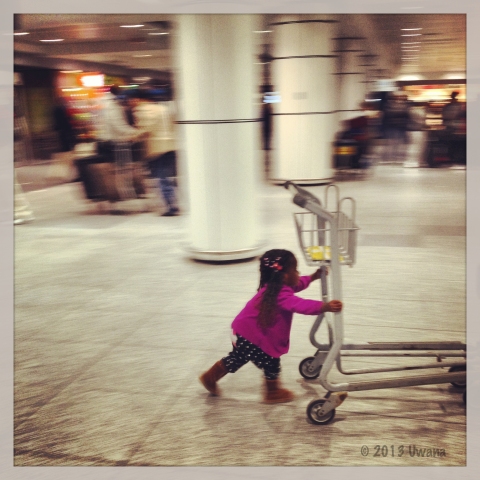 My baby girl taking charge of a trolley twice her size
